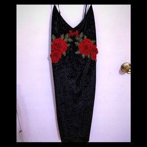 Velvet cocktail dress, red rose accents.